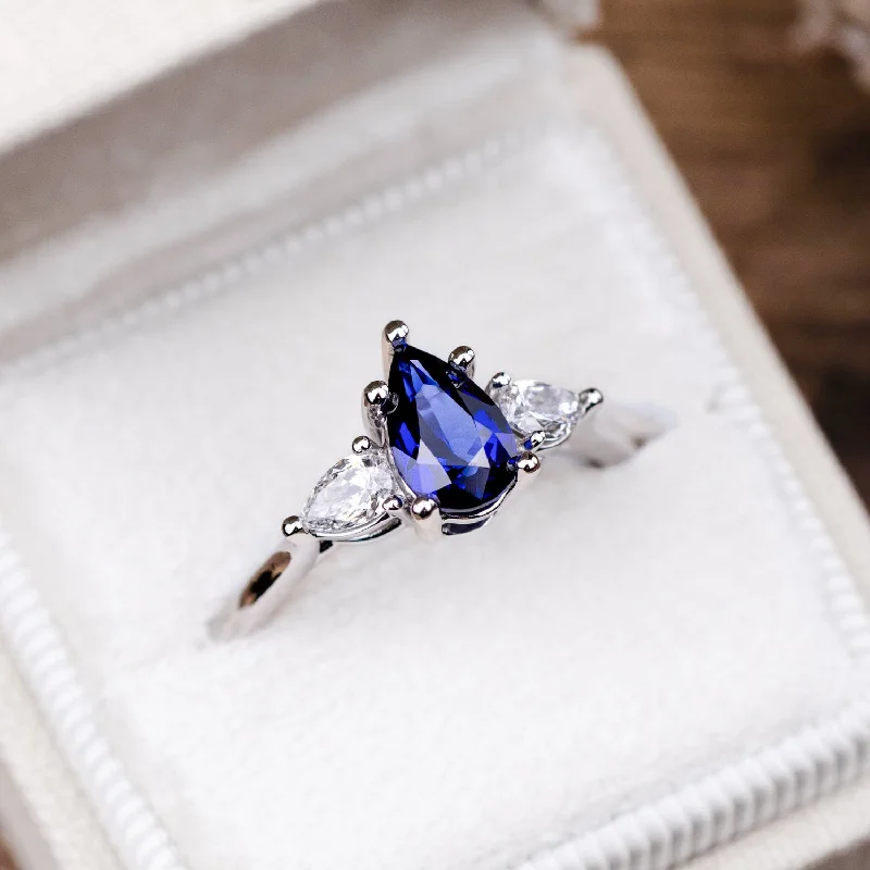 Ladies engagement rings sleek brilliance -The Diana - Blue Sapphire Pear Cut Three Stone Engagement Ring with Diamond Accents