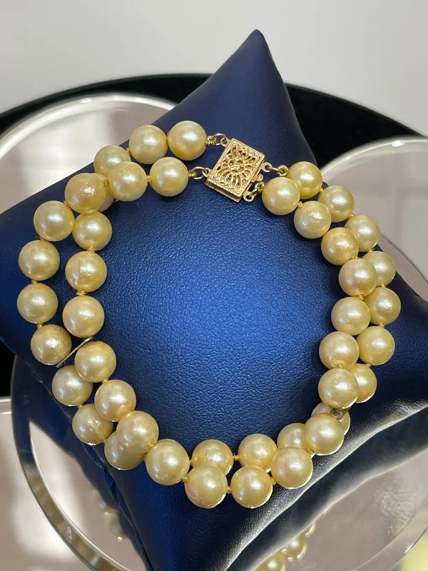 ladies-fashion-rose-gold-bracelets-14 KARAT YELLOW GOLD AND DOUBLE STRAND PEARL BRACELET