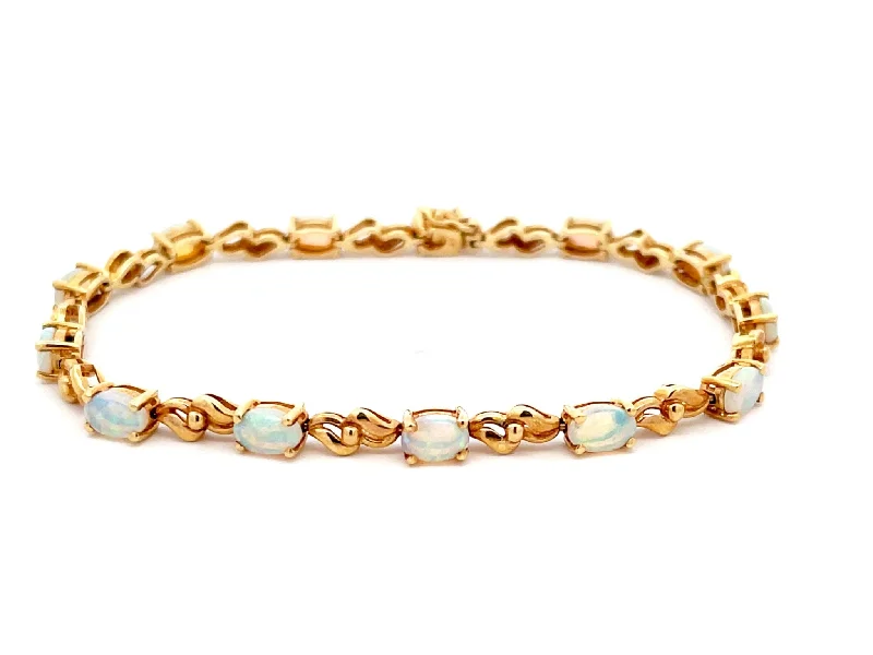 ladies-party-diamond-bracelets-Opal Tennis Bracelet in 14k Yellow Gold