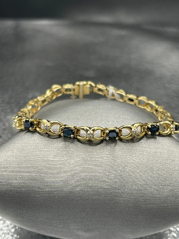 ladies-modern-silver-bracelets-14 Karat Yellow Gold Sapphire And Diamond Bracelet